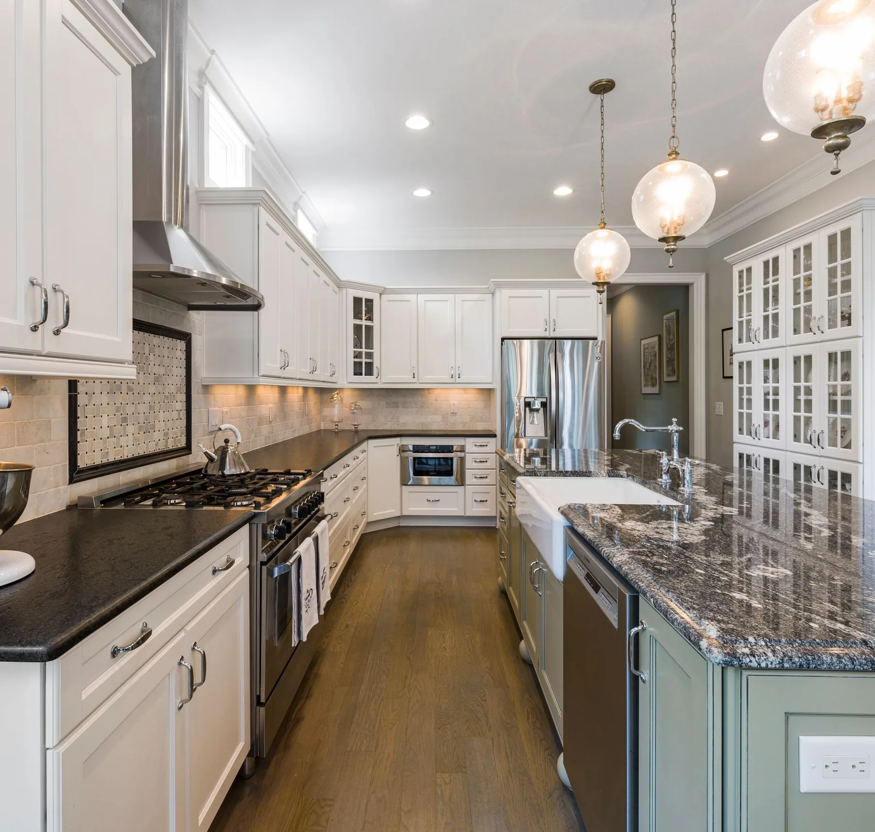 Bright, well-kept kitchen with white cabinetry representing the homes served by Quiroga's Cleaning Service